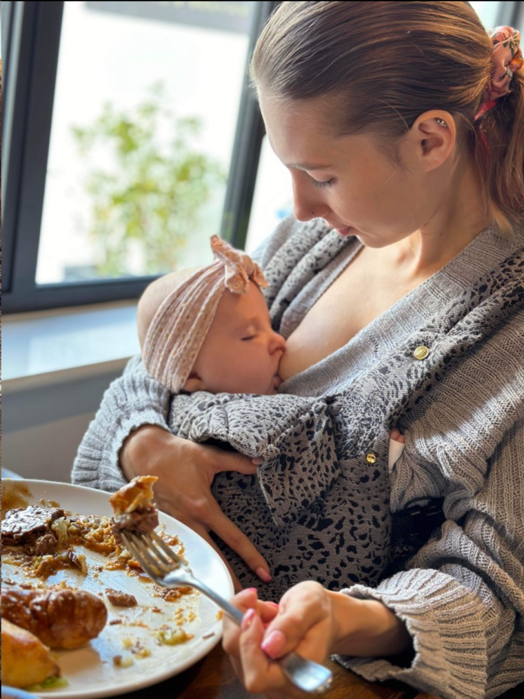 Shauna enjoying lunch while breastfeeding.